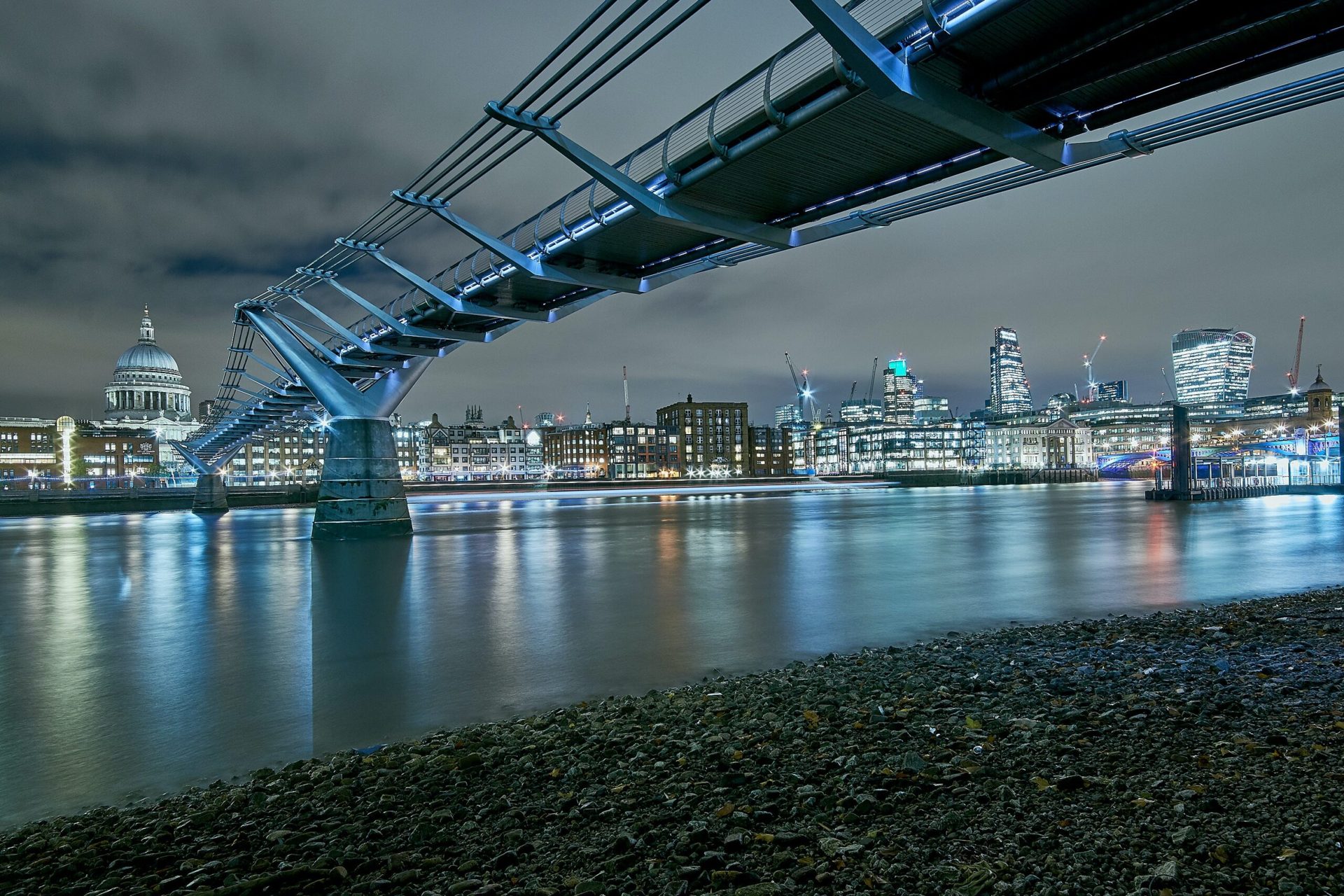 A bridge over the River Thames at night